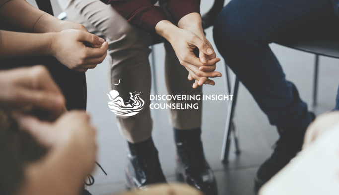 Discovering Insight Counseling logo on image of group counseling meeting